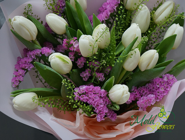 Bouquet of white tulips and statice photo